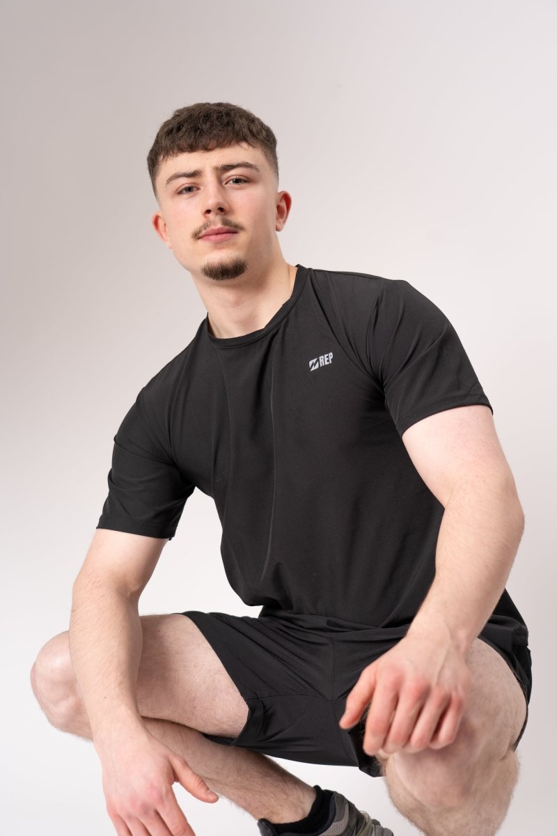 REP men’s black gym top worn during strength training, reps clothing UK, gym tops for men, represent t shirt