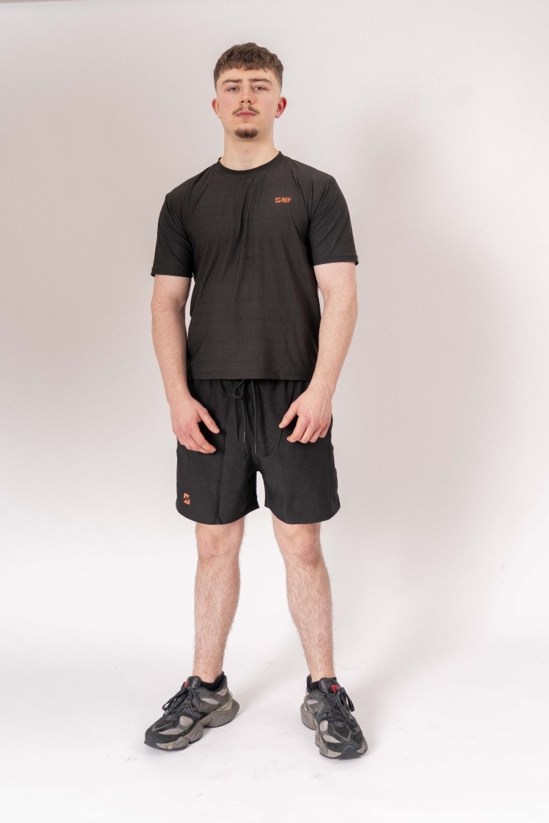 REP black gym top styled by male model – rep clothes, represent clothing