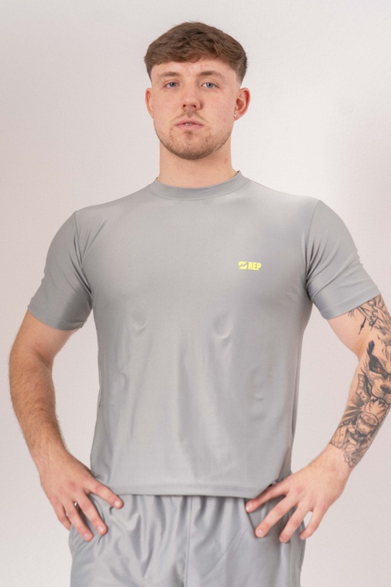 men's grey gym t-shirt, grey workout shirt for men, men's athletic grey t-shirt, grey fitness t-shirt men, moisture-wicking gym shirt, breathable workout shirt men, slim fit grey gym tee, men's performance t-shirt grey, quick-dry gym t-shirt men, lightweight workout shirt men, durable gym t-shirt grey, men's training t-shirt grey, grey activewear t-shirt men