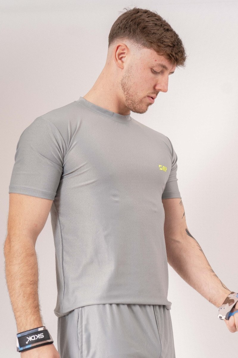 men's grey gym t-shirt, grey workout shirt for men, men's athletic grey t-shirt, grey fitness t-shirt men, moisture-wicking gym shirt, breathable workout shirt men, slim fit grey gym tee, men's performance t-shirt grey, quick-dry gym t-shirt men, lightweight workout shirt men, durable gym t-shirt grey, men's training t-shirt grey, grey activewear t-shirt men