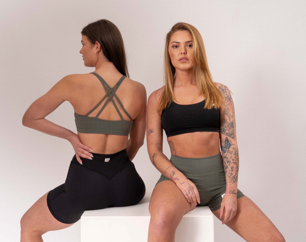 Female model wearing REP black set – sports bras women, gym tops womens, represent clothing