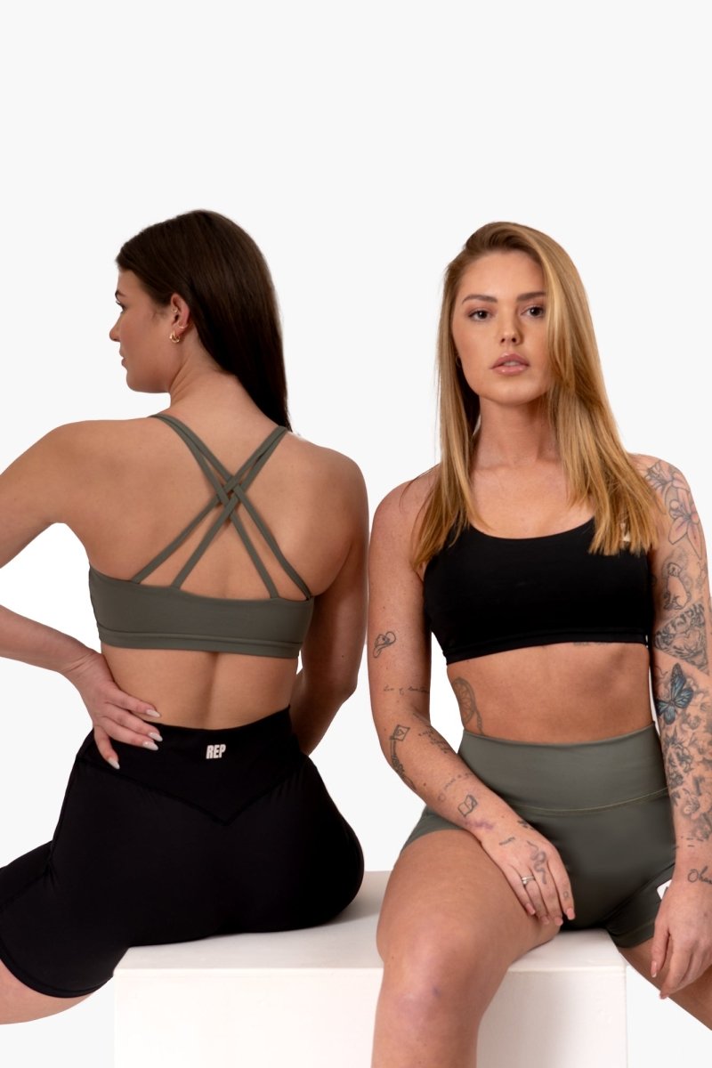 Female model wearing REP black set – sports bras women, gym tops womens, represent clothing