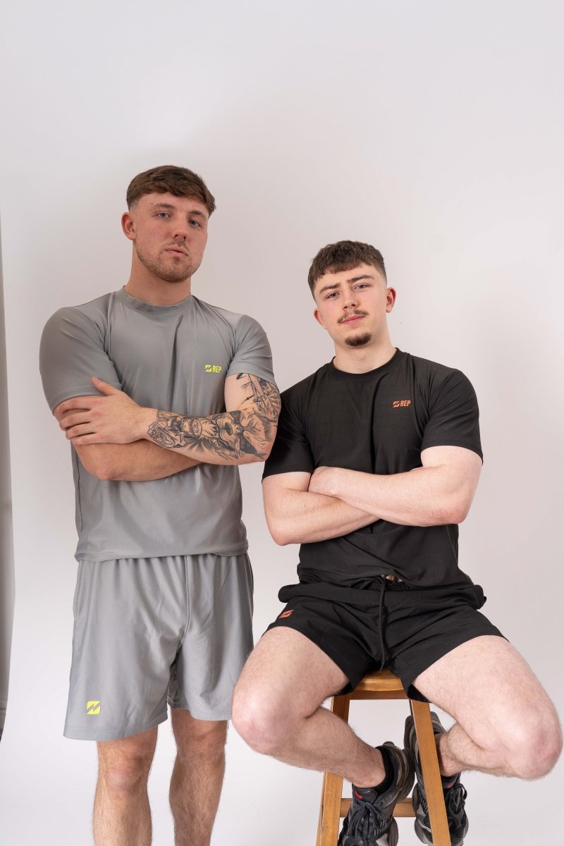 Group of athletes in REP activewear post-session – reps clothes, black gym top. 