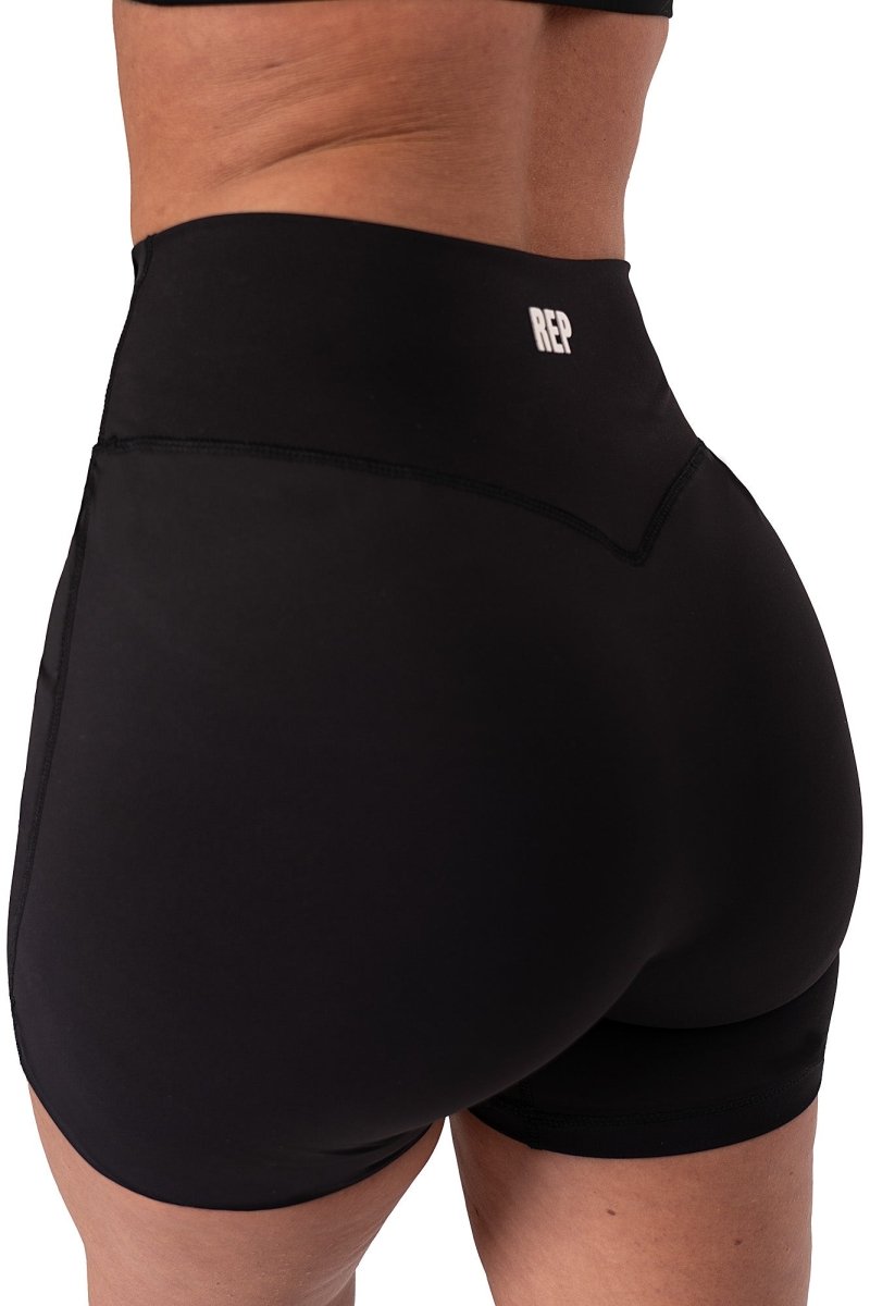 Female model in black REP sports bra and shorts – women gym tops, reps uk clothing.